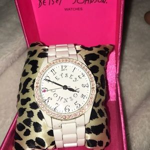 White with pink rhinestones Betsey Johnson watch.